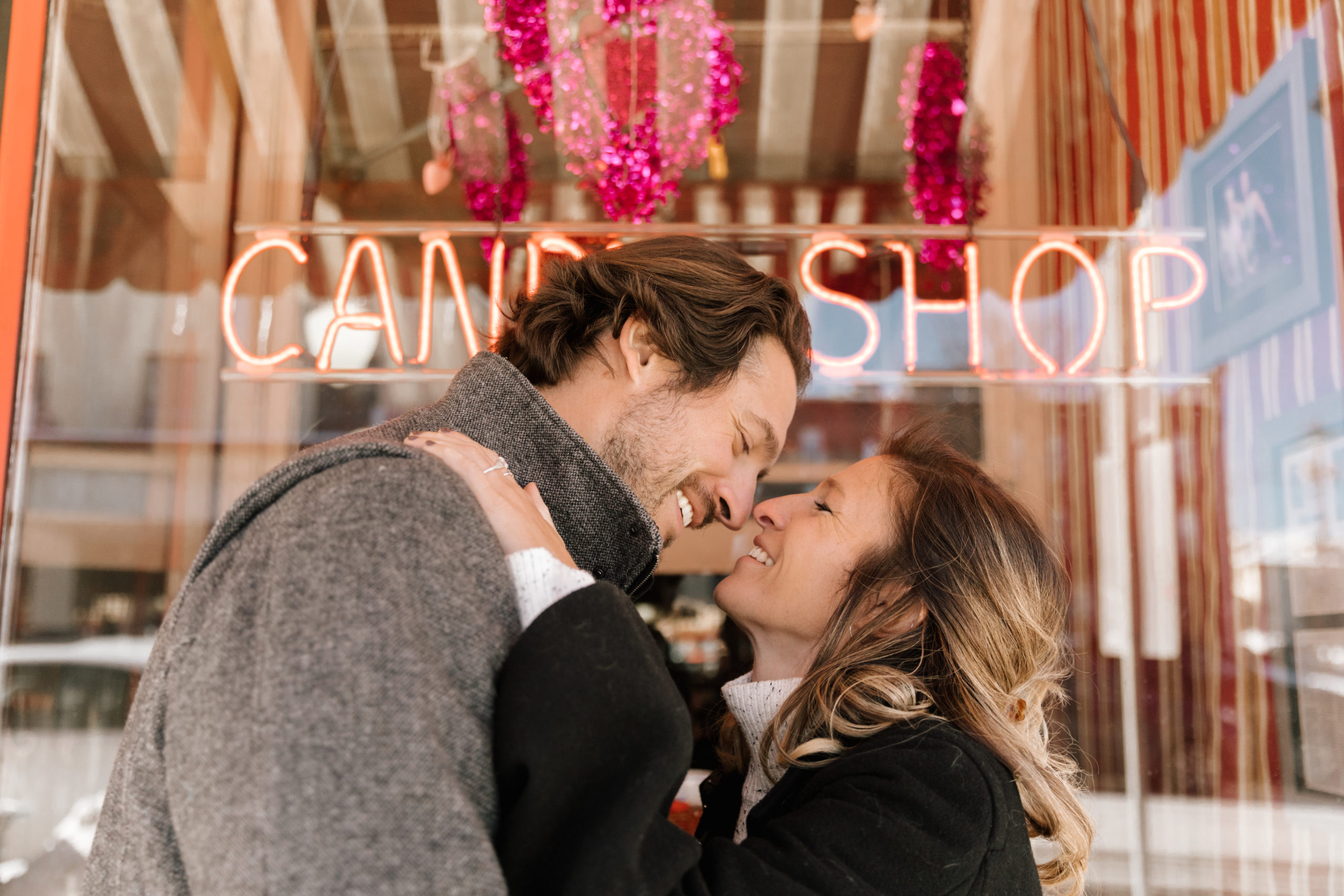 Couple smiling coffee shop valentine's day engagement picture ideas